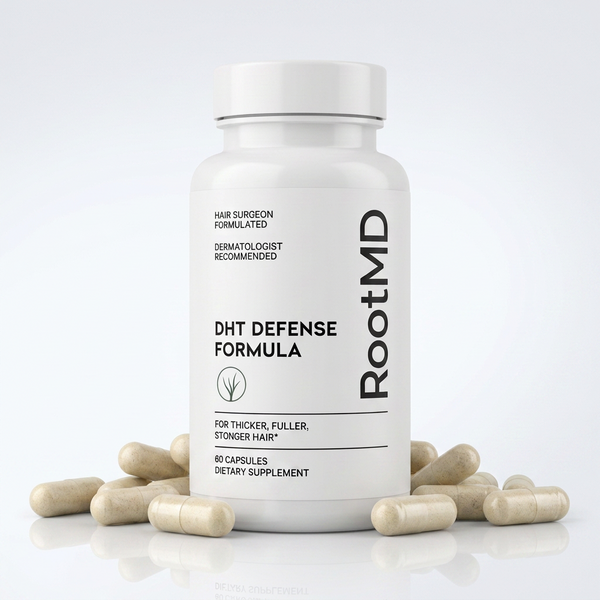 A white bottle of RootMD DHT Defense Formula dietary supplement capsules, surrounded by scattered beige capsules on a clean white background.